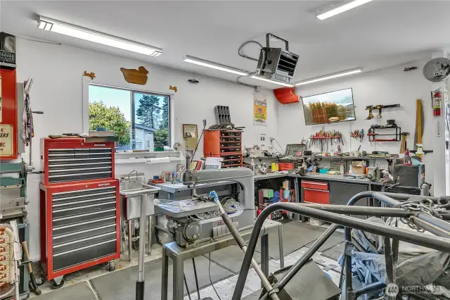 Great shop area, plumbed for water and has heat source.