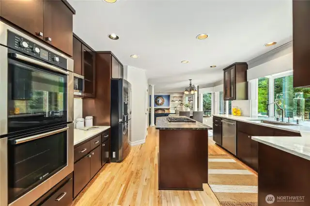 Kitchen with double ovens and center island cooktop