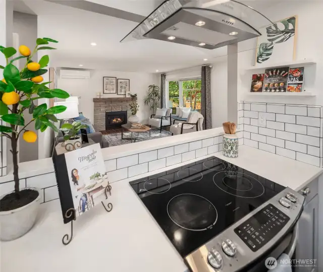 The kitchen is partially open to the living room and dining area, providing a little separation but still providing that open concept feel.