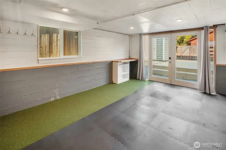 A fun flex space! Use as an exercise room, putting green, or an extra storage area.