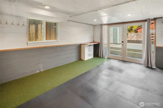 A fun flex space! Use as an exercise room, putting green, or an extra storage area.