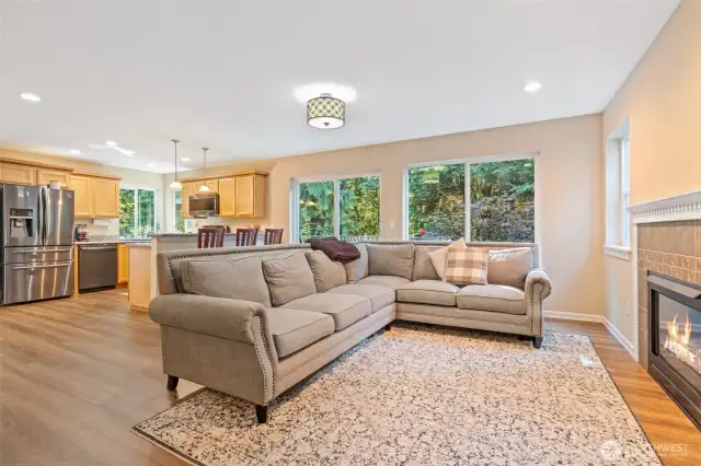 Main level sitting area with patio doors to large deck.