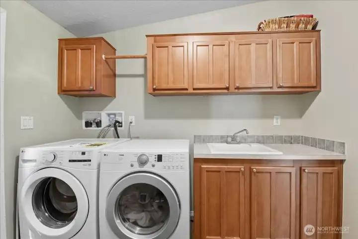 Utility room with full size washer and dryer