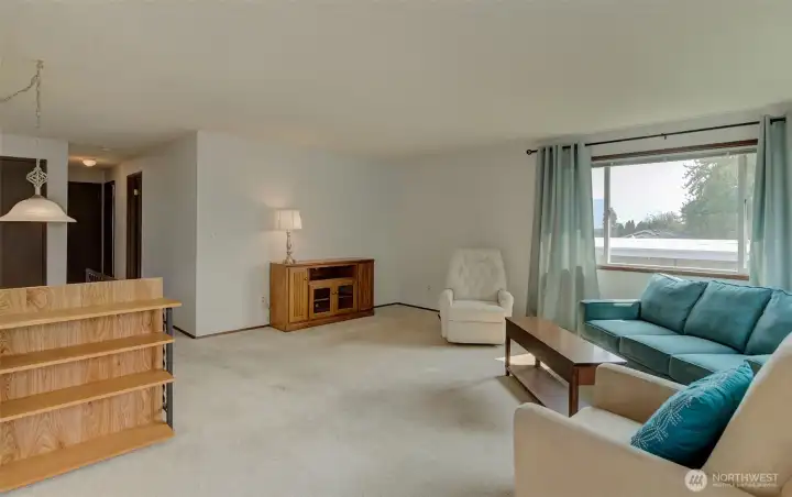 Living room with a view and hall to bedrooms & bathroom.