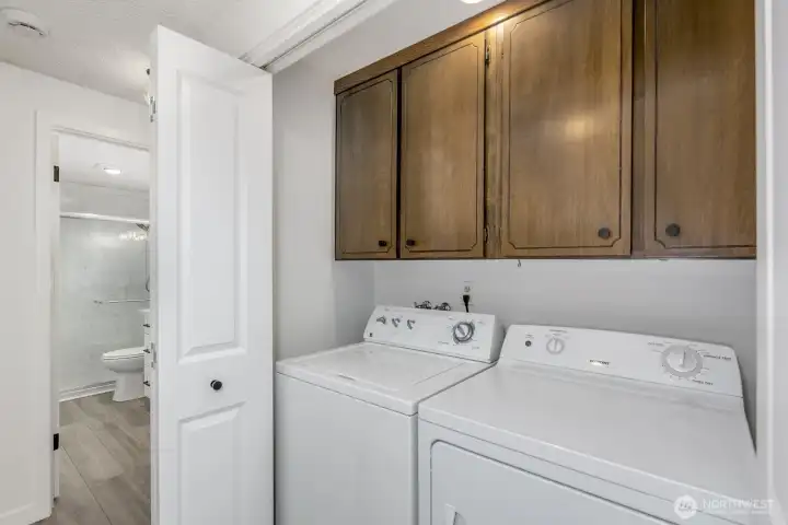 Utility area with full size washer / dryer.