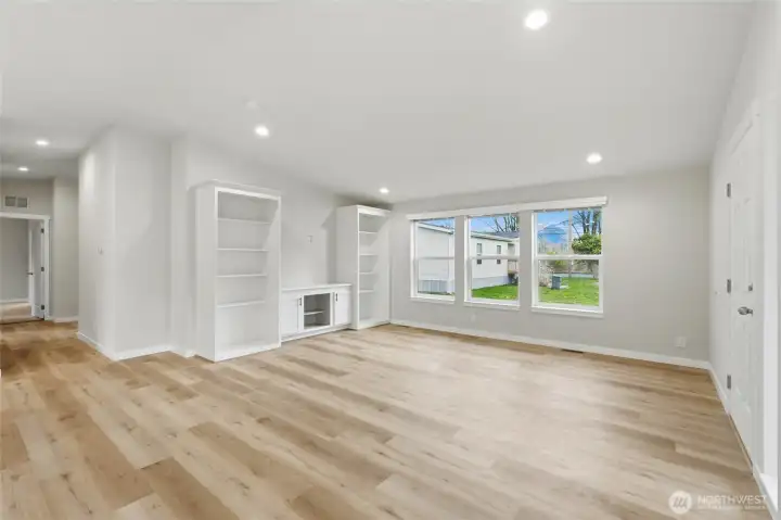 Durable flooring with light-brown tones adds warmth and makes cleaning a breeze in high traffic areas.