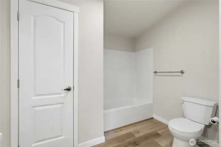 En suite includes a large additional linen closet—perfect for extra storage and everyday convenience.