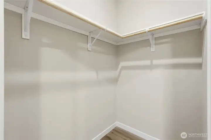 Walk-in closet off the primary bedroom provides ample storage.