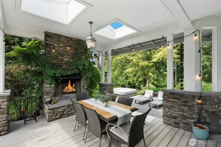 Covered outdoor entertaining with gas/wood burning fireplace. Covered outdoor entertaining with gas/wood burning fireplace.