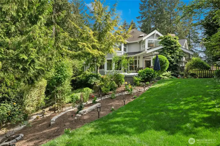 Lush large lawn with beautiful mature landscaping. Lush large lawn with beautiful mature landscaping.