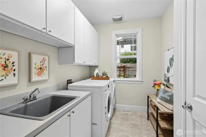 Large laundry room off mudroom and massive 3 car garage with built-in over head storage. Large laundry room off mudroom and massive 3 car garage with built-in over head storage.