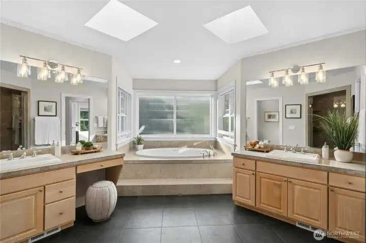 Dual separate vanities, soaking tub with privacy windows and shades Dual separate vanities, soaking tub with privacy windows and shades