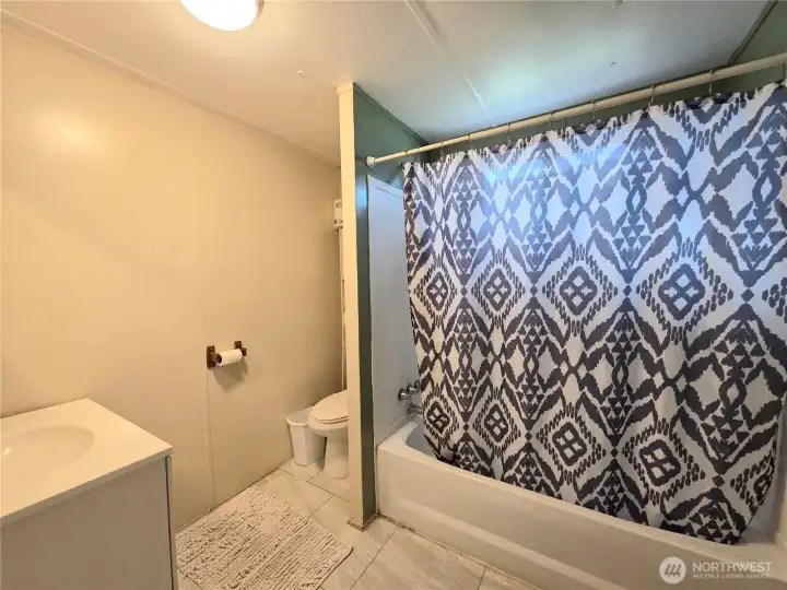 Spacious full bathroom.