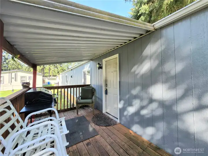 Enjoy coffee, sunsets and summer BBQ's at this covered patio/deck.