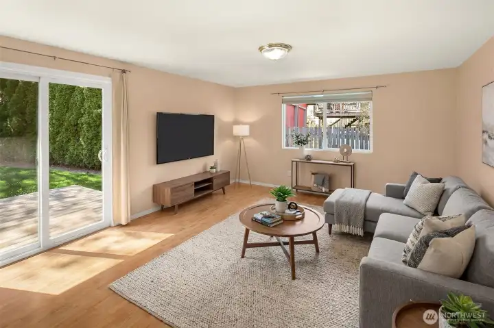 Family room with slider out to the newer trex deck. Virtually staged