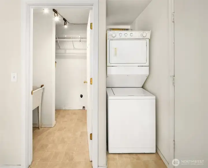 Utility room with slop sink and washer and dryer - to the right is the door to the carport.