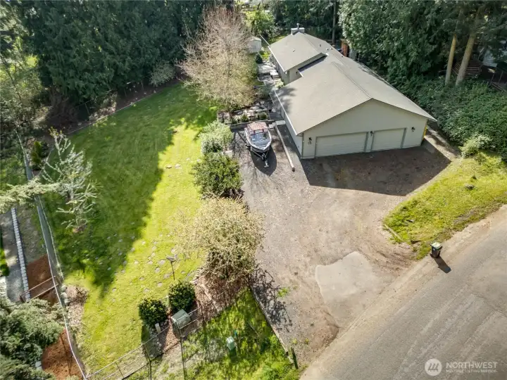 Aerial perspective highlighting the home, surrounding land, and natural privacy