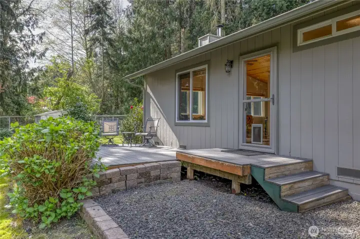 Entry and deck area creating a welcoming transition into the home