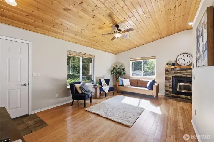 Bright living room with vaulted wood ceilings and natural light
