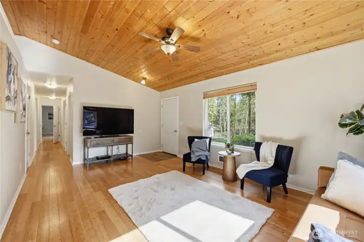 Alternate living room view showing layout and connection to adjacent spaces