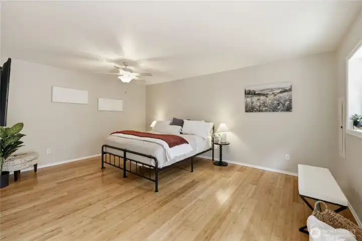 Primary bedroom with generous space and natural light