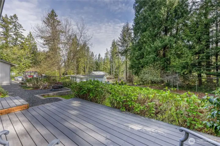 Deck overlooking the yard, ideal for outdoor dining or gatherings