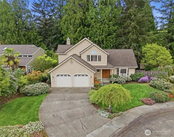 The home sits back from the dead-end street nicely and is actually adjacent to a partial cul-de-sac for additional privacy. Not just a beautiful front yard but wonderful side yards as well!