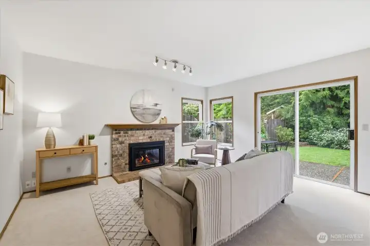 The newly installed, efficient gas fireplace with brick surround and traditional wood mantle provide the perfect focal point for the family room.  Everybody loves a mantle!