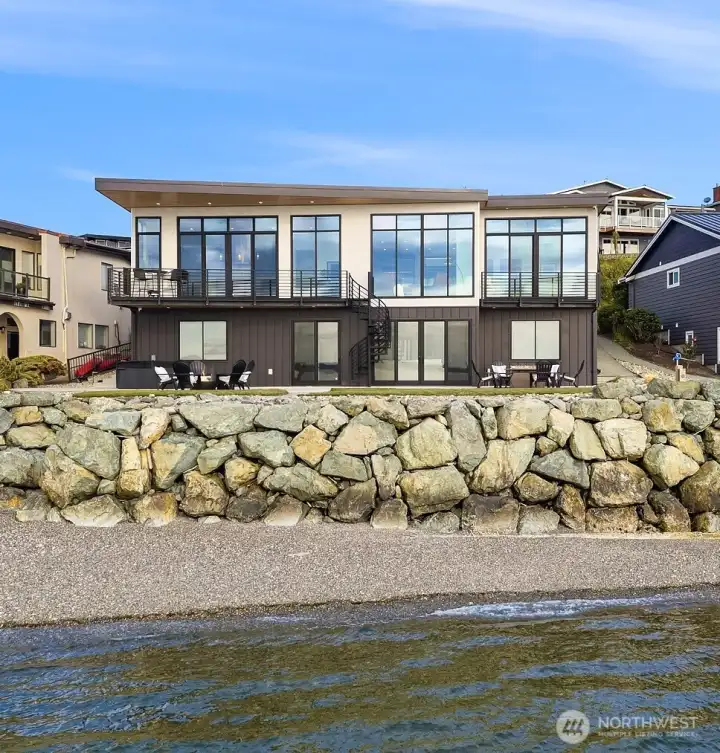 Coveted low bank shoreline with panoramic Saratoga passage and Olympic mountain views.