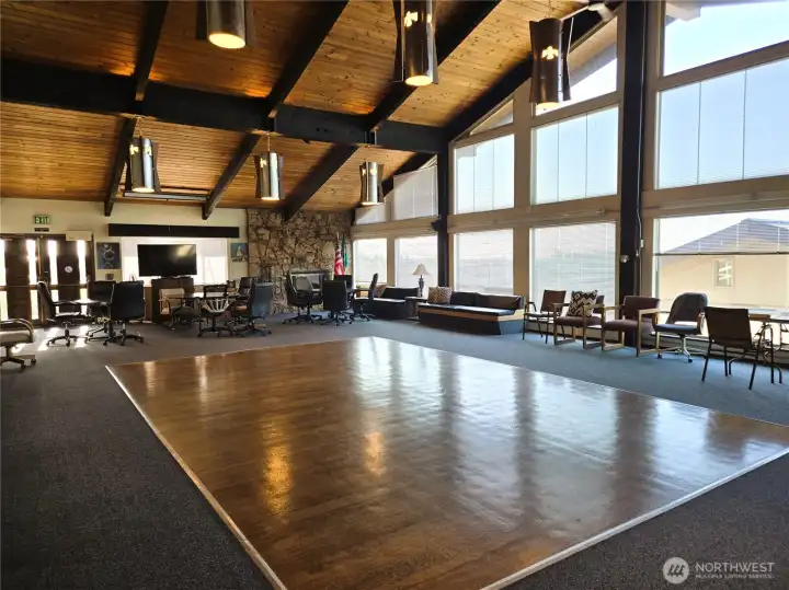 Clubhouse Greatroom with dance floor and plenty of table & chair space for gatherings, parties, and meetings.
