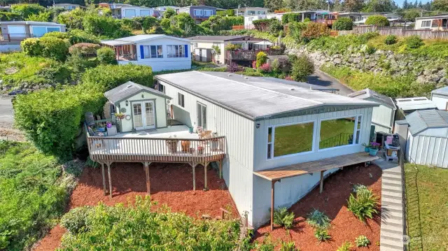 Entertainment sized deck with sweeping water views and shed ready for you to make it your own!