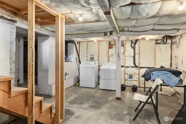 Unfinished basement with laundry.