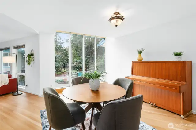 A wall of windows to enjoy the sun in dining area.