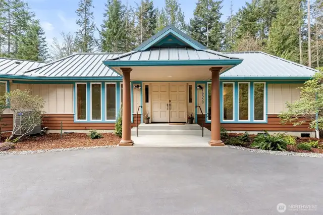 Nestled at the end of a long private drive, this beautifully maintained one-level home is bathed in natural light.