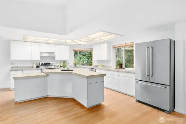 So many work spaces in this kitchen, including the new tile countertop on kitchen island.