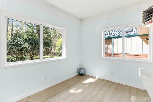 Sunlit, heated flex space with a sink. Maybe a gym? Art studio? Bring your vision. Accessed from garage.