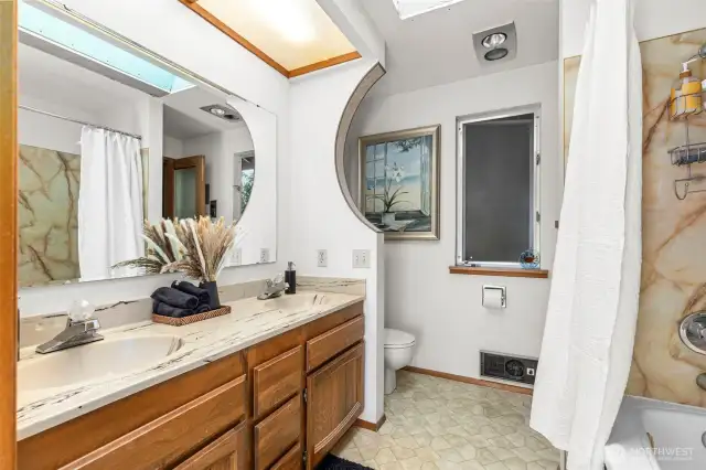 Primary bath. Storage area behind mirrored wall for possible future expansion