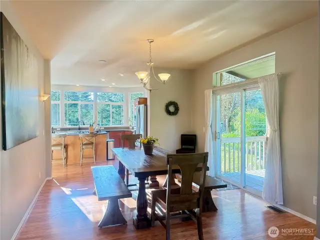 Dining space situated directly between kitchen and living room and with direct access to gazebo and sitting area above the ponds and water. With the doors or windows open, enjoy the soothing sound of the waterfall.