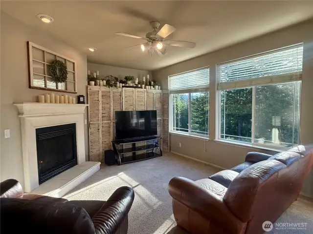 Gather around the fireplace in the family room just off the kitchen.