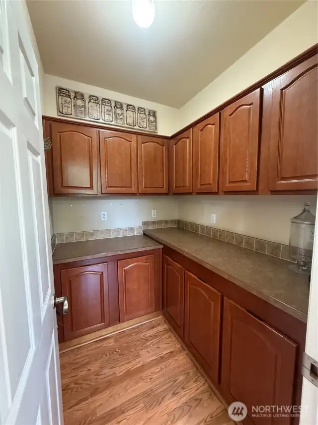 Walk-in pantry provides ample storage and small appliance storage.