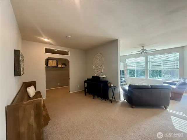 Bonus space between living room and family room serves as additional gathering space and music room.
