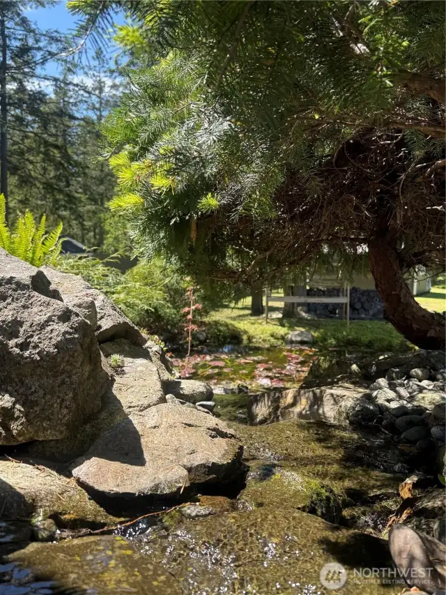 The sound of the water adds a calming ambiance to the outdoor setting.