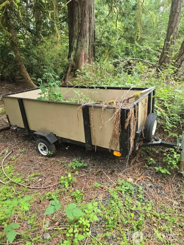 Utility trailer included in list price.