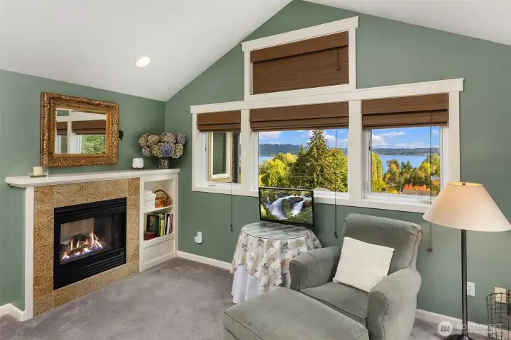 Gas fireplace and sitting area complete the primary bedroom