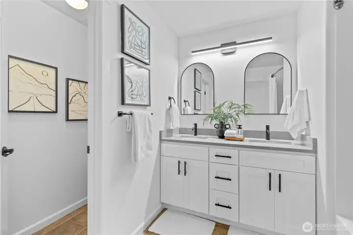 Remodeled full bathroom situated between 3 upstairs bedrooms.