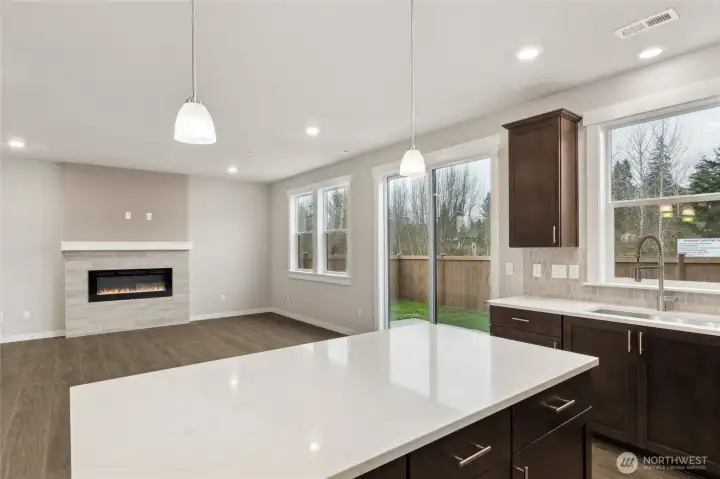 Kitchen opens to great room - home for sale is on a corner homesite and is very private.