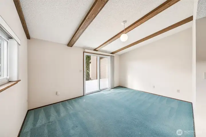 4th Bedroom toward front of home also has access to the deck overlooking the fenced front yard.