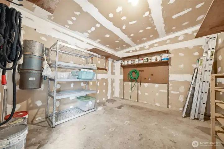 Large storage shed has a vacuum system with outlet to carport for easy car interior cleaning! There is also an exterior hot water faucet.