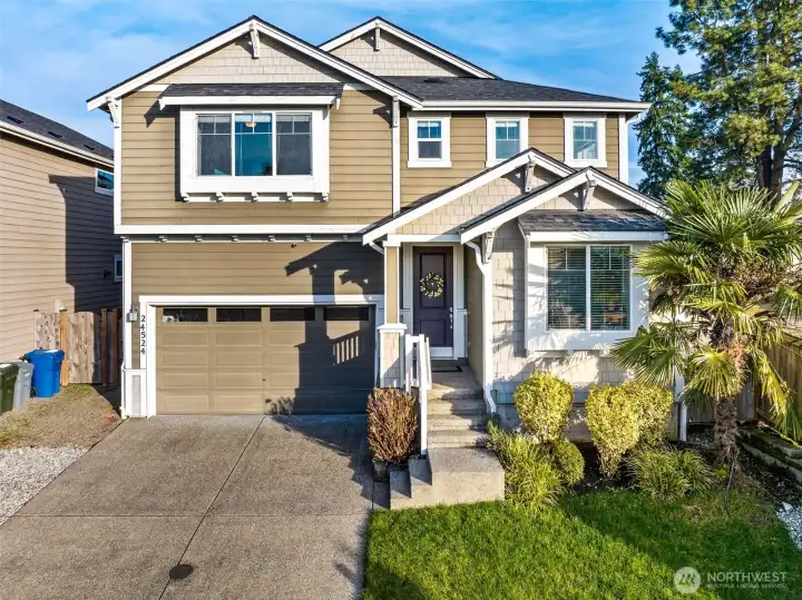 Charming curb appeal with a welcoming front entry and well-maintained landscaping.