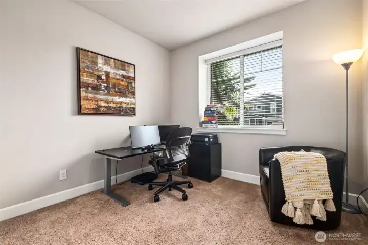 Versatile main-level room ideal for a home office, guest space, or hobby room.